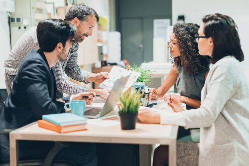 Multi-ethnic group of people in discussion in the office